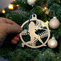 Decorative ornament with fish and hook design hanging on Christmas tree, festive holiday décor for seasonal display and fishing-themed Christmas decorations