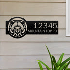 Personalized bear cabin house number sign, rustic metal décor with bear head design mounted on wooden wall near window
