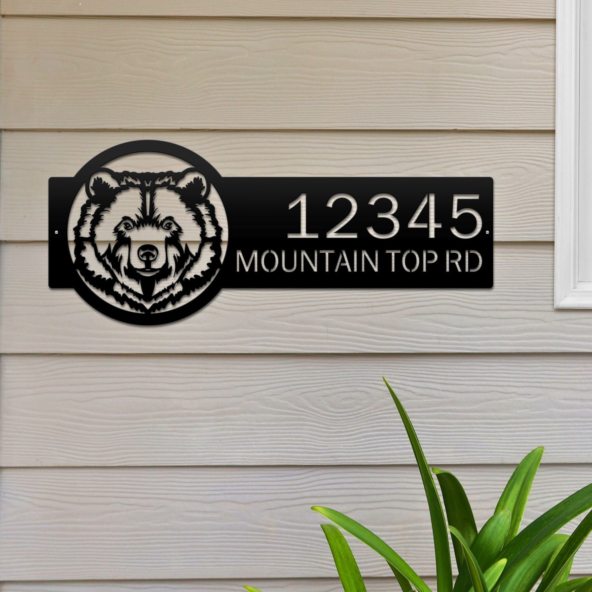 Personalized bear cabin house number sign, rustic metal décor with bear head design mounted on wooden wall near window
