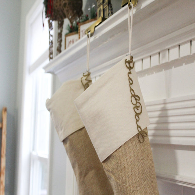 Christmas stocking hanging on fireplace mantle with decorative elements, festive holiday décor for seasonal home display and Christmas celebration