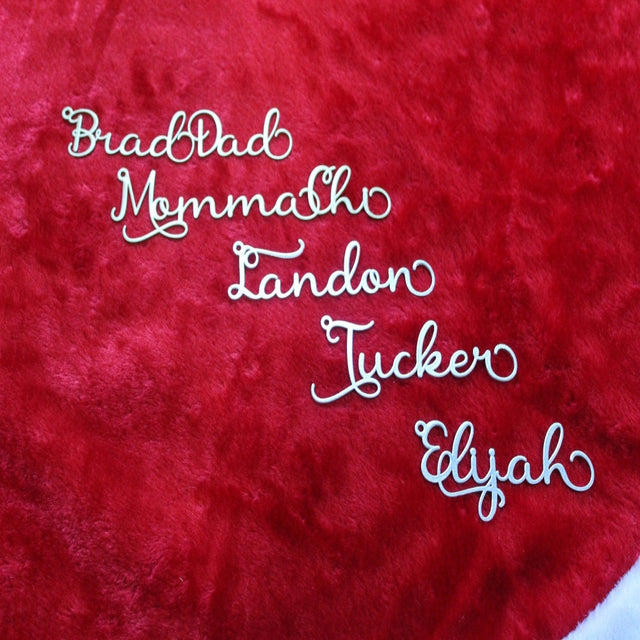 Names embroidered on red fabric background, personalized textile design for gifts, holiday décor, or custom craft projects