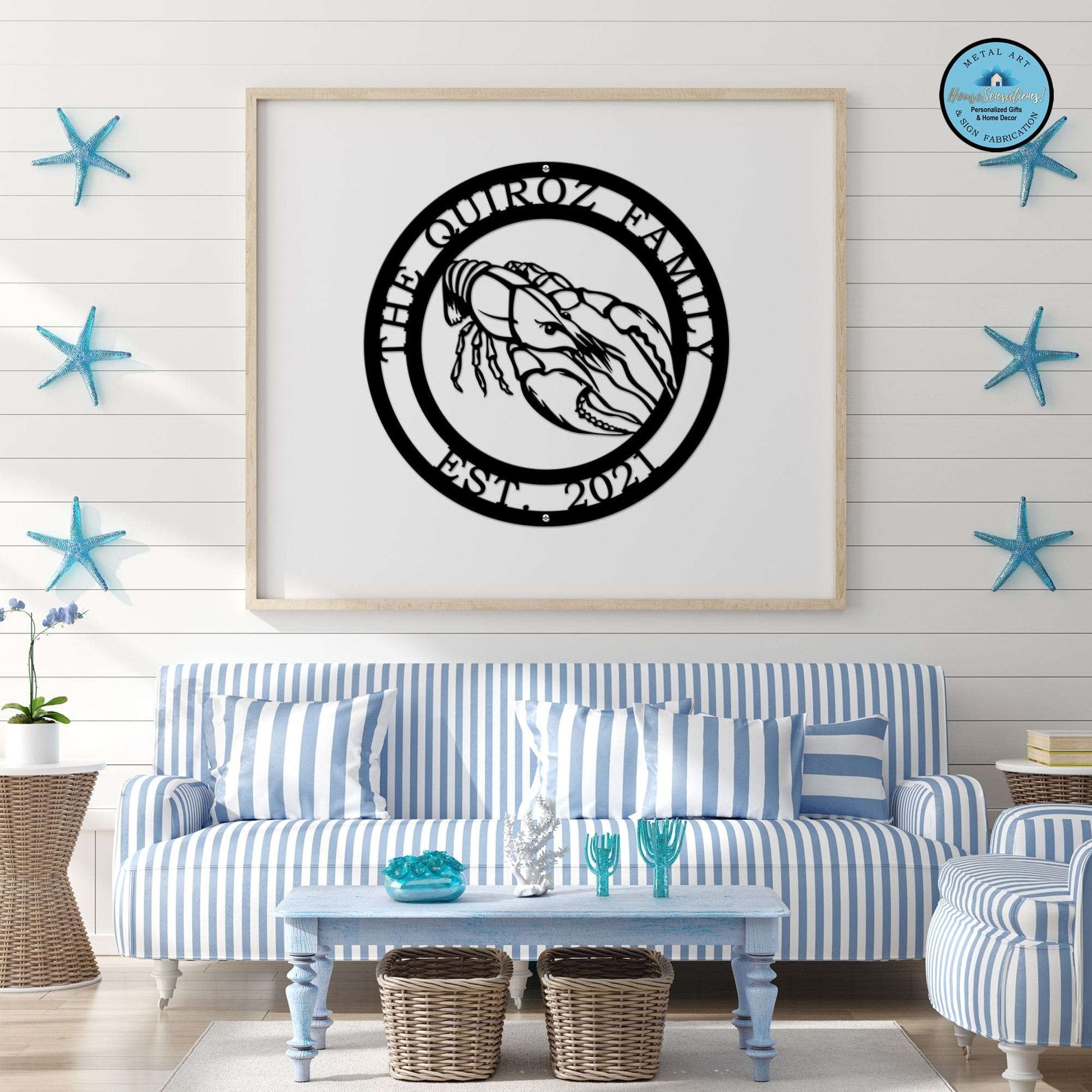A black custom laser cut metal sign showing crawfish in center, with “THE QUIROZ FAMILY EST 2021” text, beach-themed room decor.