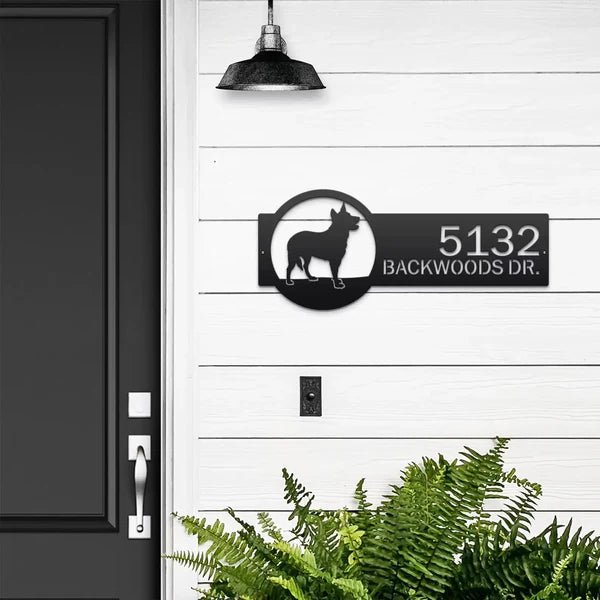 Personalized house address metal sign with dog silhouette, mounted on white wall next to black door, front door outdoor décor