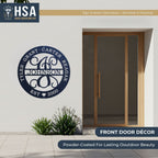 House exterior featuring a decorative metal sign with personalized design, HSA logo, and front door décor text, showcasing custom family name signage for entryways.