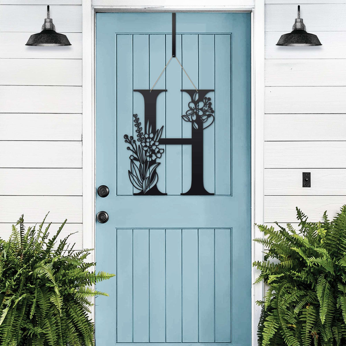 Personalized floral monogram metal door sign “H” on blue door, custom farmhouse entry décor, white wood wall, front porch decorative sign