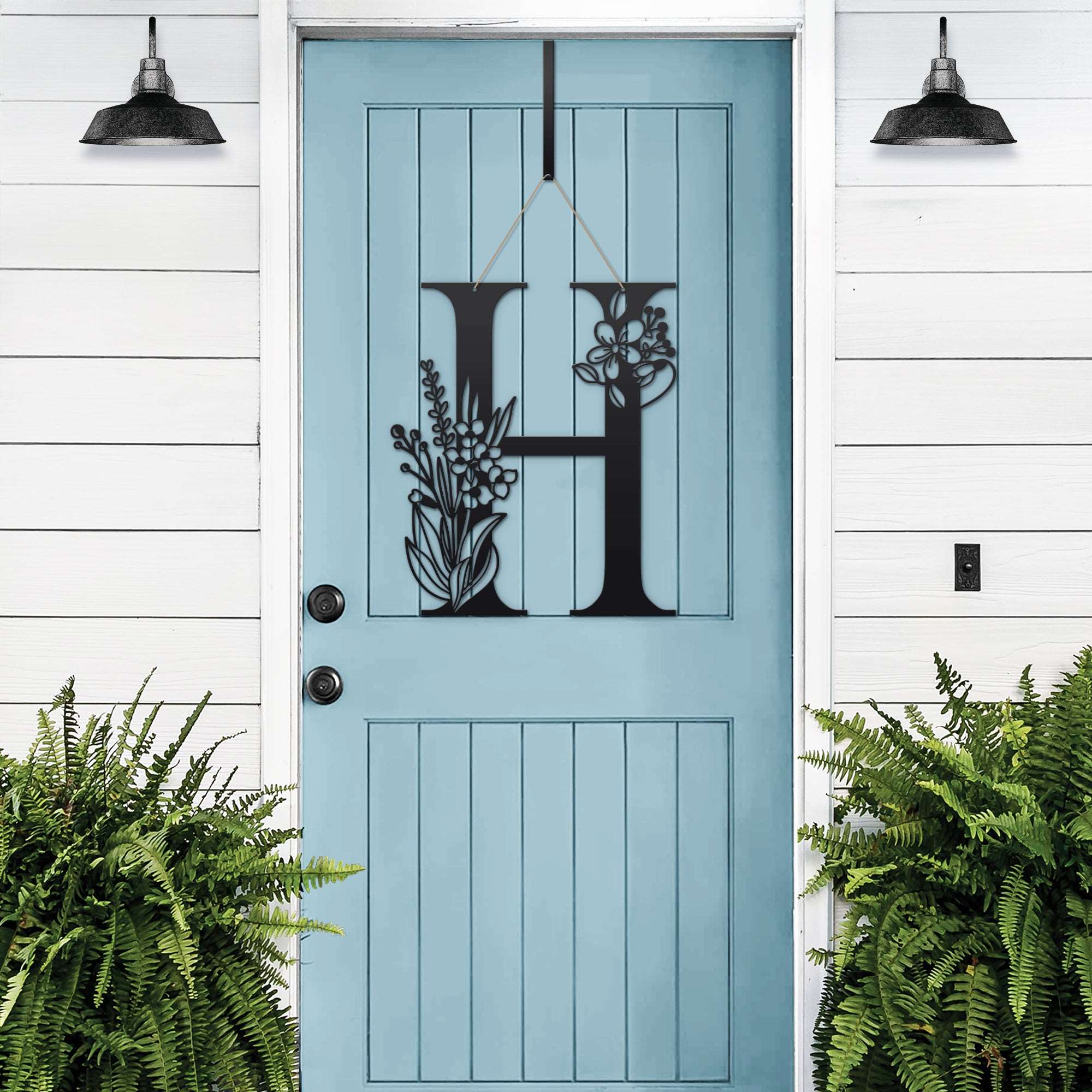 Personalized floral monogram metal door sign “H” on blue door, custom farmhouse entry décor, white wood wall, front porch decorative sign