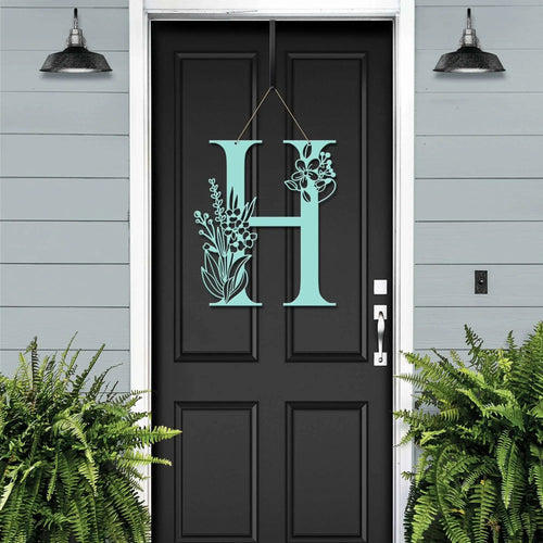 Personalized floral monogram metal door sign “H” on black door, powder blue accent, custom farmhouse front entry décor, House Sensations Art style sign
