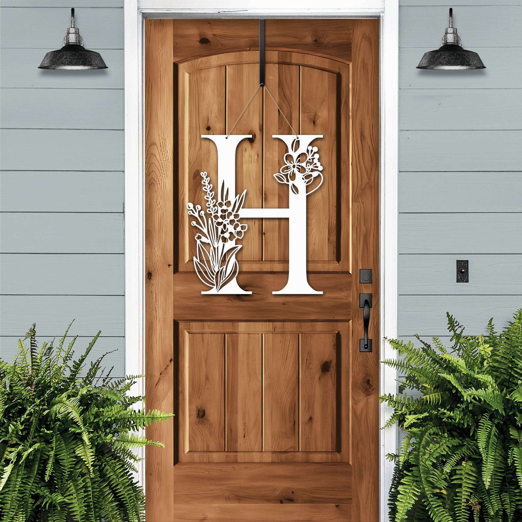 Personalized floral monogram metal door sign “H” on wood door, cream accent, farmhouse entry décor, custom front porch wall art with plants