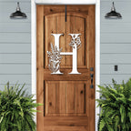 Personalized floral monogram metal door sign “H” on wood door, cream accent, farmhouse entry décor, custom front porch wall art with plants