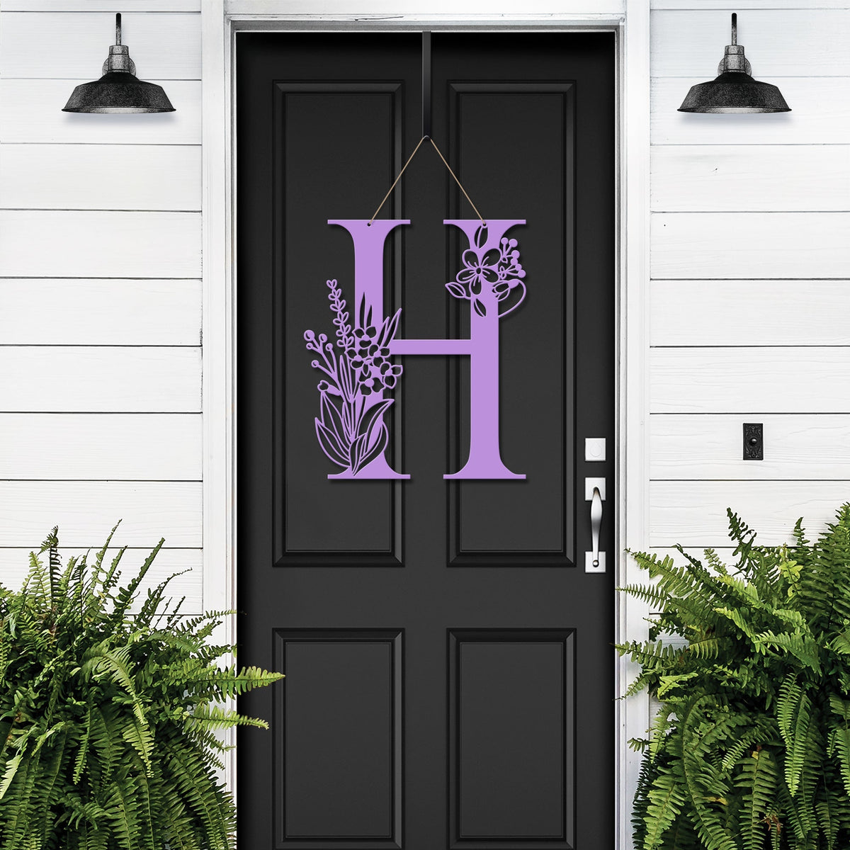 Personalized floral monogram metal door sign “H” in violet on black door, custom farmhouse entry décor, front porch wall art, white wall background