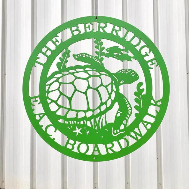 Lime green custom laser cut metal sign showing turtle, seaweed, and fish, with “THE BERRIDGE E.A.C BOARDWALK” text, mounted on wood wall.