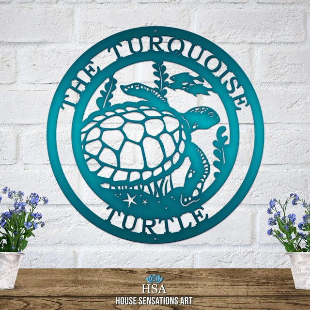Candy teal custom laser cut metal sign showing turtle, seaweed, and fish, with “THE TURQUOISE TURTLE” text, mounted on brick wall.