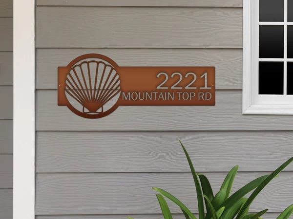 Bronze Seashell Address Sign with seashell logo on right and house number '2221 MOUNTAIN TOP RD'.mounted on door wall.Navy Blue Seashell Address Sign with seashell logo on right and house number '2221 MOUNTAIN TOP RD'.mounted on door wall.
