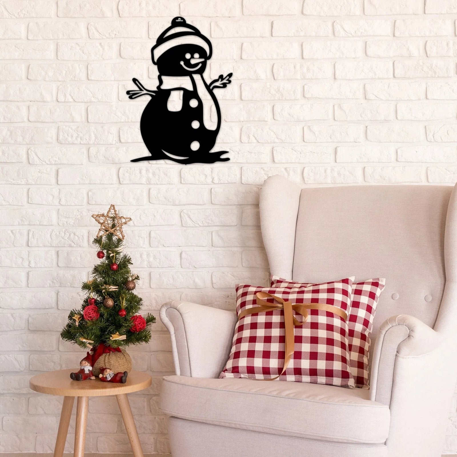 Black snowman wall décor on white brick wall, personalized Christmas sign, indoor festive decoration, winter wall art, holiday décor accent