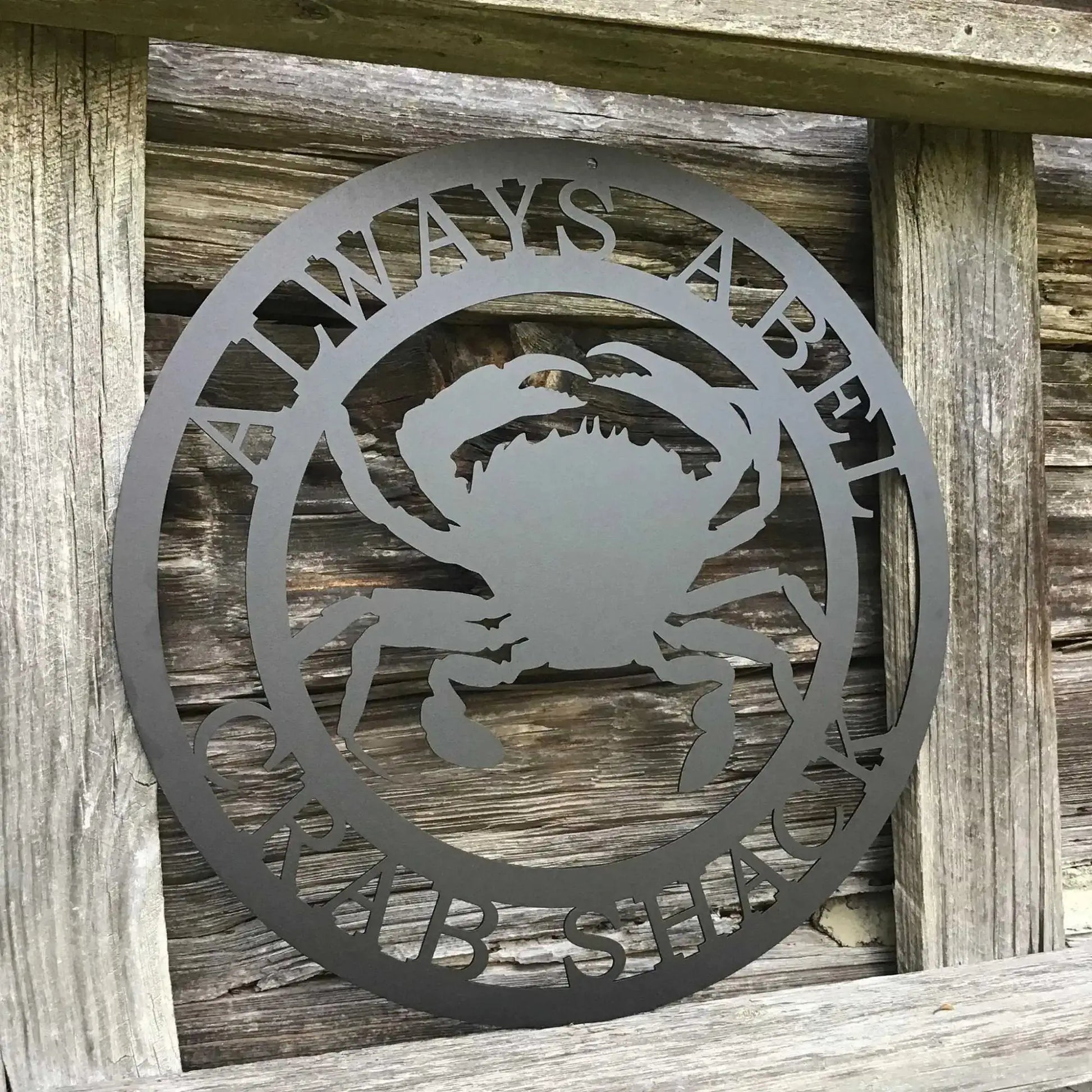 Personalized Sea Crab Sign - Custom Metal House Number Plaque for Outdoor Decor, featuring a crab motif cut from wood, mounted on a wooden fence, ideal for gardens, yards, or farms.