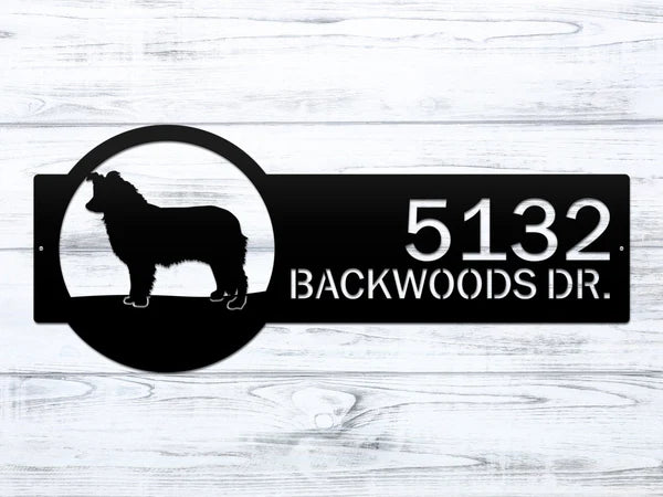 Close-up of black metal dog breed address sign with dog silhouette on right and custom text '5132 Backwoods Dr.'.