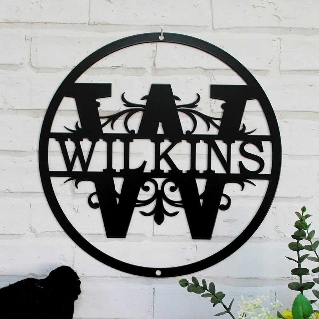 Round metal monogram sign with "WILKINS," decorative front door wall art mounted on white brick, powder coated outdoor plaque with HSA logo