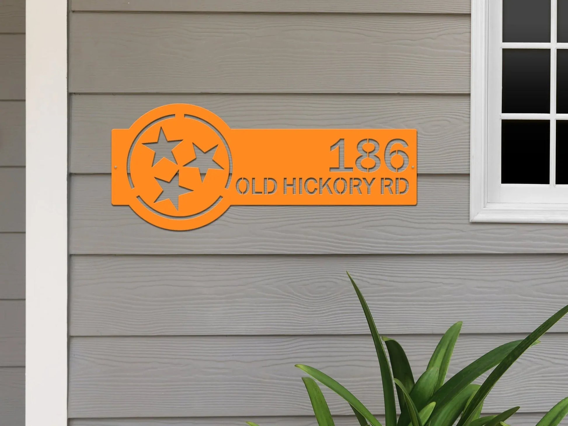 Tennessee orange Tennessee Tristar Address Sign featuring a Tristar emblem on the right and house number '186 Old Hickory Rd' on the left, mounted on the wall.