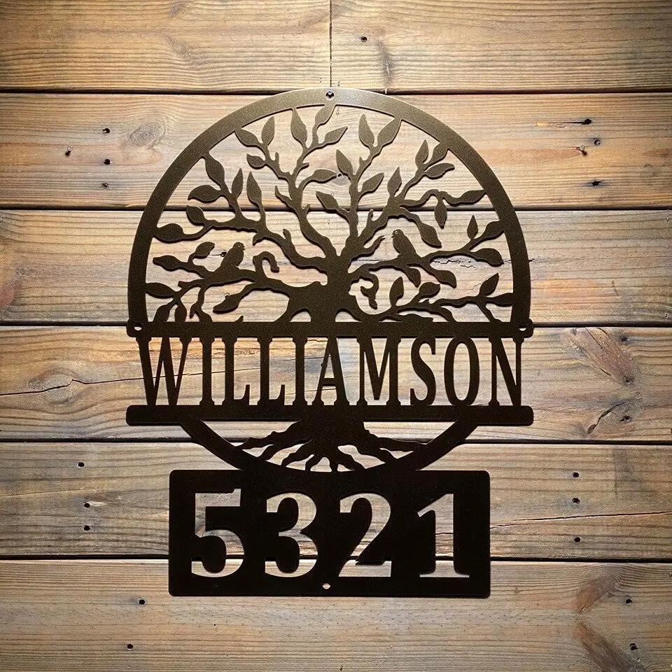 Metal wall art with tree design and house numbers "Williamson 5321" on wooden background, custom outdoor address plaque, decorative home exterior signage