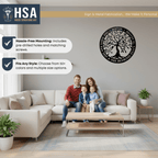 Family sitting on a couch in a living room with a wall-mounted metal art piece featuring a tree design, creating a warm and inviting home décor setting.