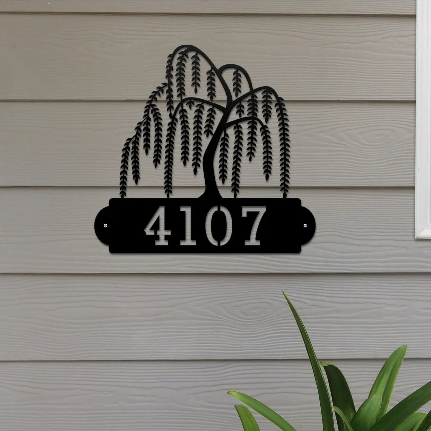 Close-up of black Weeping Willow Address Sign with a weeping willow tree design on top and house number '4107' below.