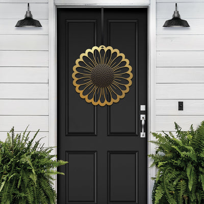 Sunflower metal wreath on black door, bright gold floral circular design, modern entryway decor, handcrafted outdoor metal sign, elegant home exterior art