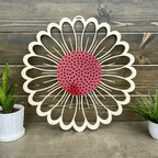 Metal flower wreath wall art with pink center and white petals on wood backdrop, rustic farmhouse décor, custom powder coated metal sign, outdoor home accent design