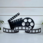 movie-reel-wall-decor-personalized-metal-art-for-film-lovers-home-theaters-front-black-display-white-wall-house-sensations-art.jpg