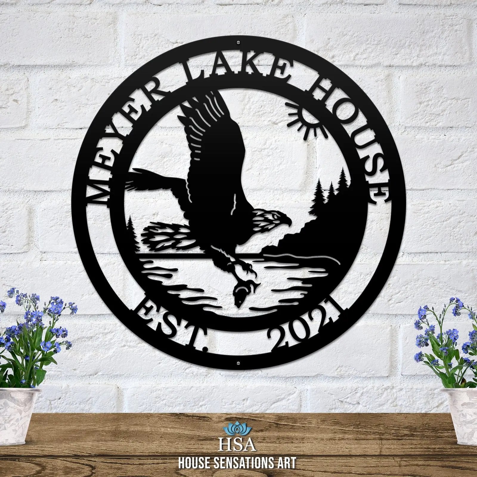 Black laser cut eagle wall sign with vivid nature scene lake, trees, and sun; personalized metal decor for outdoor settings.