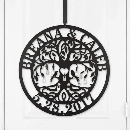 Close-up of black personalized Love Locks metal wall art on a white door