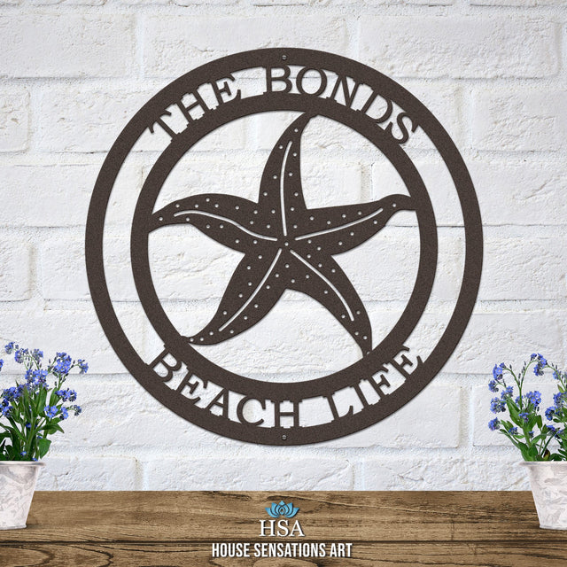 Oil-rubbed bronze custom laser cut metal beach sign with starfish and “THE BONDS BEACH LIFE” text, coastal outdoor decor.
