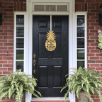 Black front door with gold pineapple metal sign, brick exterior home entry, tropical farmhouse curb appeal décor, custom powder coated welcome wall art sign