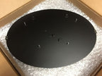 HouseSensationsArt Black circular Weld Mount System on bubble-wrapped surface with cardboard edges, featuring strong adhesive fasteners for any surface, custom powder-coated metal sign, durable outdoor-ready mounting, modern matte black finish, easy installation, personalized metal décor